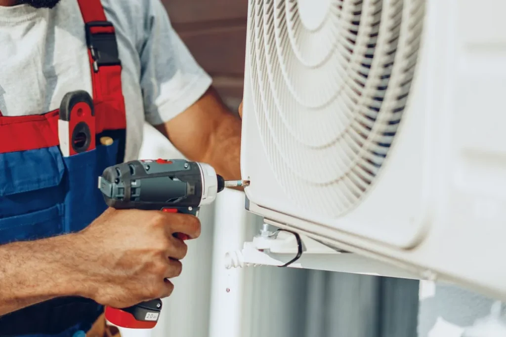 Professional mechanic installing the outside unit ac | Dr. Ductless Heating & Cooling