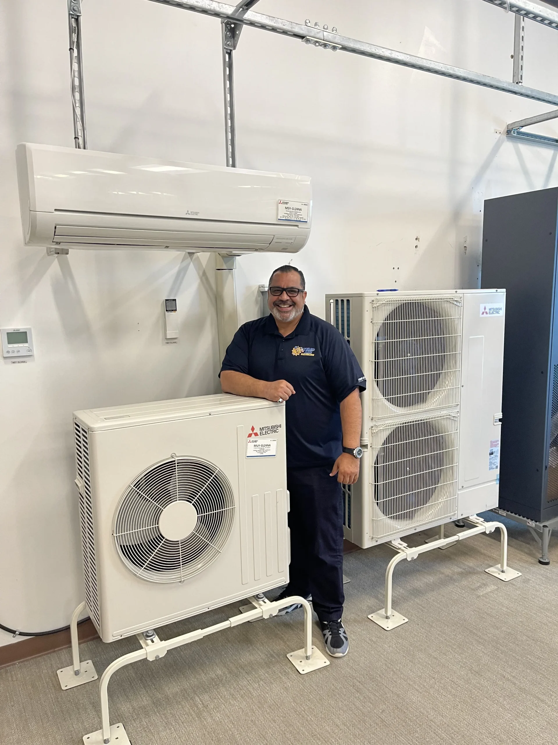 Technician with HVAC units | Dr. Ductless Heating & Cooling