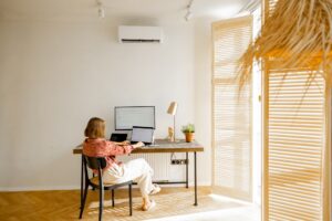 Woman works online on computers at home